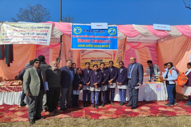 A group photograph beneath the banner at Uttarakhand Open University, Haldwani.