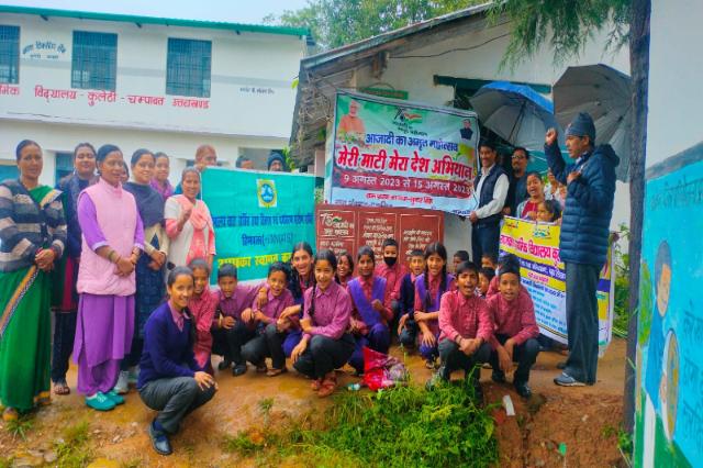 Villagers and volunteers gathered under the banner for Meri Maati Mera Desh.