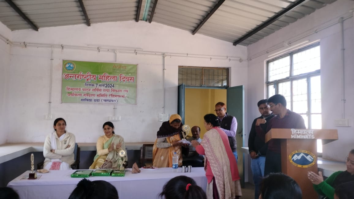 A session in progress, the speaker at the lectern beneath the banner.