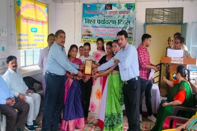 Certificates being presented at the World Environment Day prize distribution.