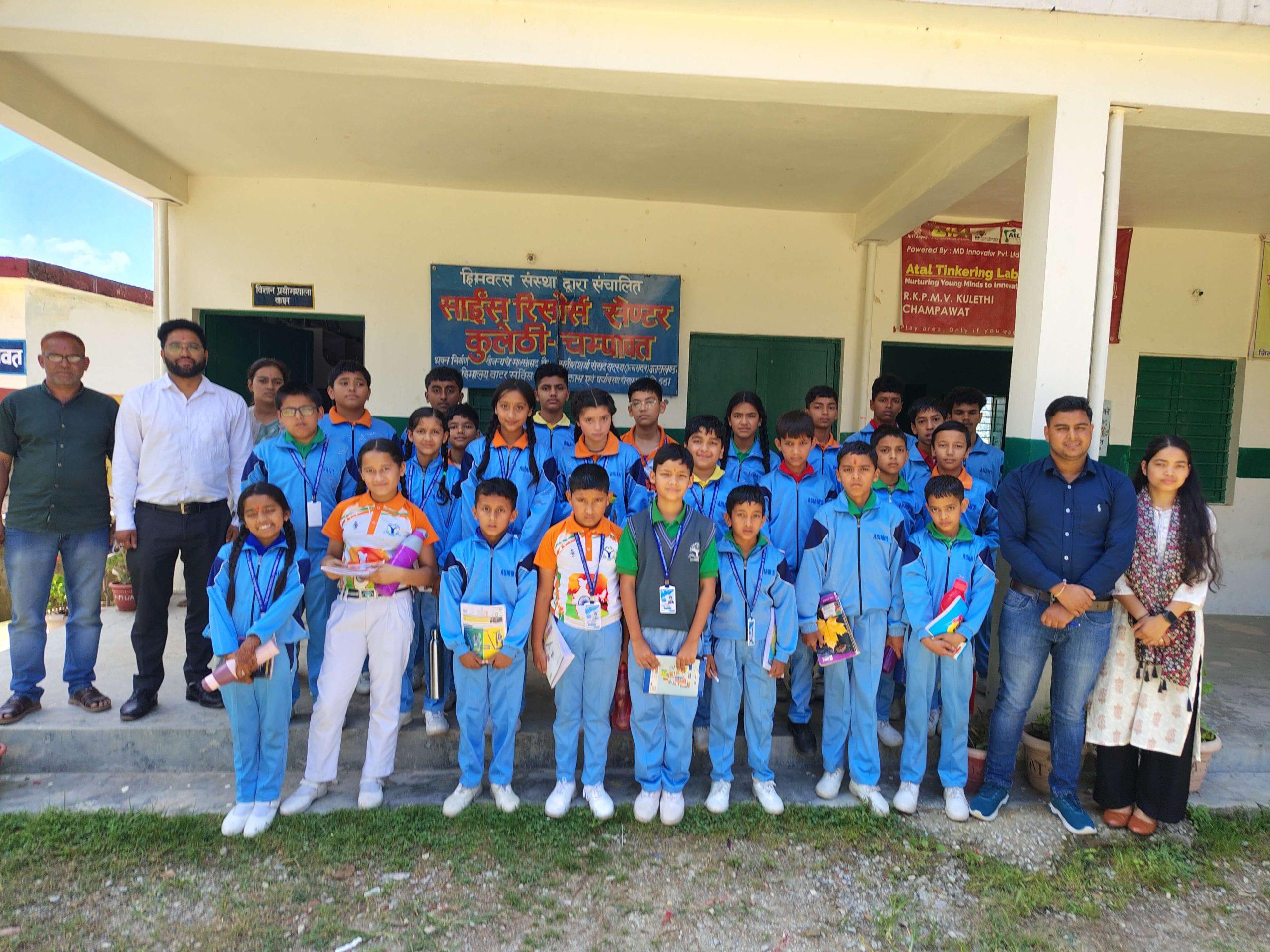 Visiting pupils from The Asian Academy School outside the Kulethi campus building.