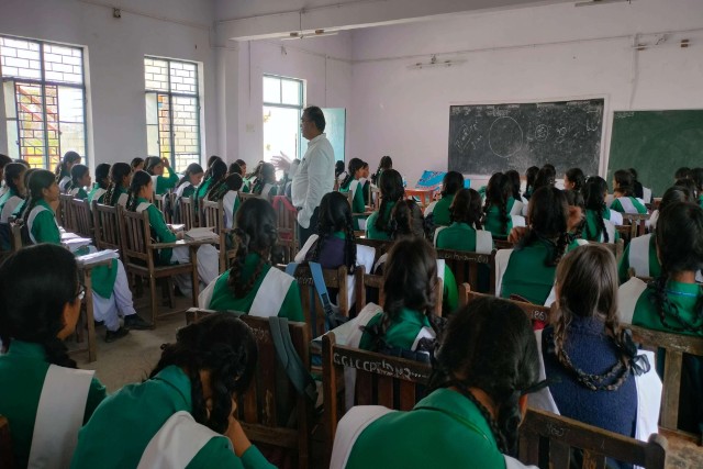 Students at their desks in the classroom.
